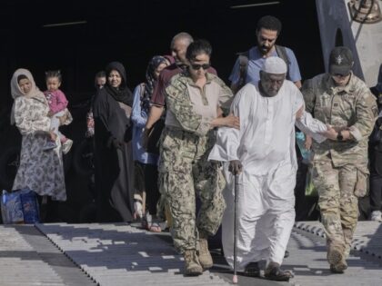 Sudanese evacuee, Mohammed Abdel Rahman, 78, is helped by US naval doctors as he disembarks from the USNS Brunswick at Jeddah port, Saudi Arabia, Thursday, May 4, 2023. After more than two weeks of fighting, areas of the capital of Khartoum appear increasingly abandoned. The Sudan fighting, which broke out …