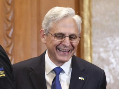 WASHINGTON, DC - SEPTEMBER 20: U.S. Attorney General Merrick Garland (R) and Ukrainian Prosecutor General Andriy Kostin laugh together as they arrive for a signing ceremony at the Department of Justice on September 20, 2022 in Washington, DC. The two signed a memorandum of understanding establishing a formal framework for …