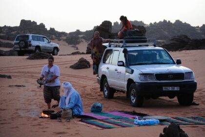 Local tour guides set up camp in the desert near the oasis town of Djanet in southeastern Algeria
