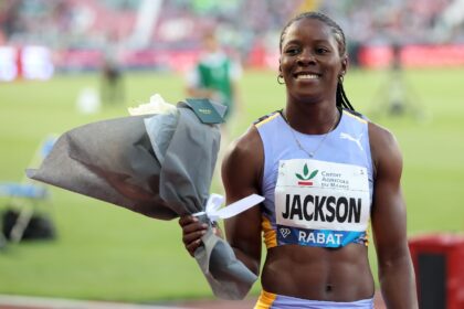 Shericka Jackson won the women's 100m title at the Jamaican Athletics Championships in a personal best of 10.65 seconds, the fastest time in the world this year