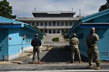 Soldiers stand guard before North Korea's Panmon Hall and the military demarcation line separating North and South Korea, at Panmunjom, in October 2022